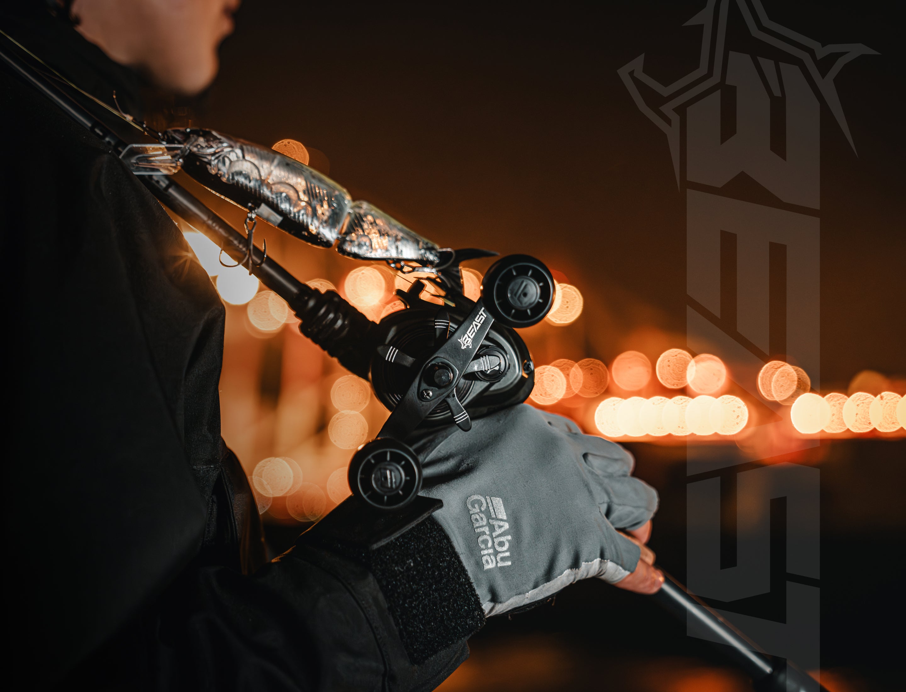 Abu Garcia Beast Reel in a hand with a large bait
